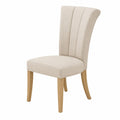Silla de comedor tapizada en poliéster beige con patas de madera de roble