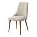 Silla tapizada en tela beige con patas de madera